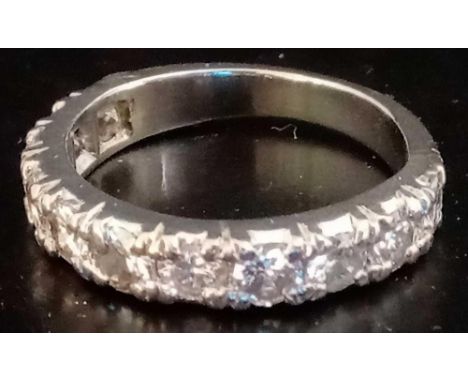 AN 11 STONE DIAMOND HALF ETERNITY RING IN WHITE GOLD - SIZE 'L'