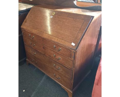 GEORGE III MAHOGANY SLOPE FRONT BUREAU, INTERIOR FITTED WITH DRAWERS &amp; CUBIHOLES &amp; 4 LONG DRAWERS BELOW WITH BRACKET 