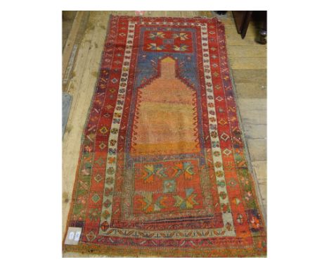An Eastern rug, decorated geometric motifs on a light blue ground, within a multi border, 188 x 98 cm