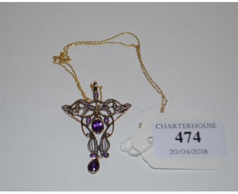 An Art Nouveau style 9ct gold, amethyst and seed pearl pendant, on a 9ct gold chain Condition report Modern