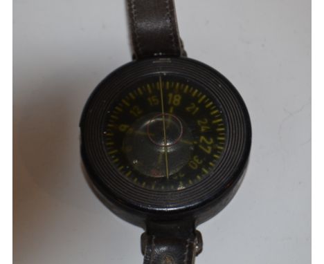 A German military issue divers wrist compass, a camera lens, and two other items (4)