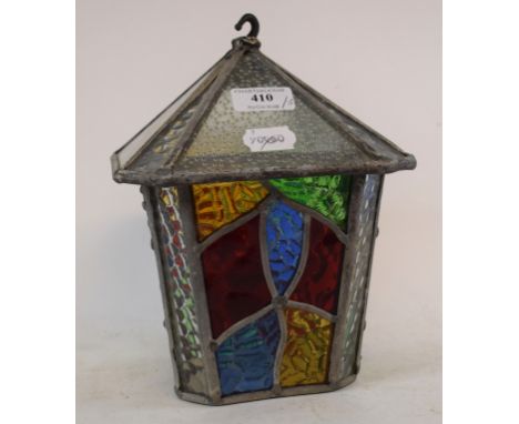 A stained glass hanging lantern, 22 cm high, another similar, converted to a table lamp, 43 cm high, and three stained glass 