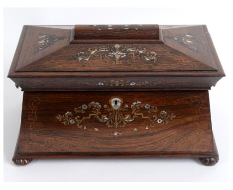 A Victorian rosewood tea caddy, of sarcophagus form, inlaid vases, flowers and foliage, the interior with a central mixing bo