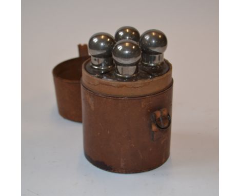 A quartet hunting flask, the glass bottles with plated tops, in a leather case, 14.5 cm high, an Edwardian inlaid mantle cloc