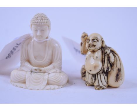 An early 20th century Japanese carved ivory Buddha, signed on a red lacquer tablet, 6 cm high, and a Japanese carved ivory ne