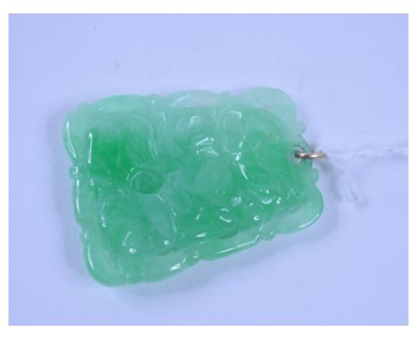 A Chinese jade pendant, with carved and pierced decoration, 3.5 cm high