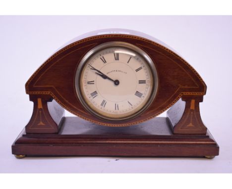 An Edwardian mantel clock, the 8.5 cm enamel dial signed Walker & Hall, with Roman numerals, in an inlaid mahogany case, 15.5