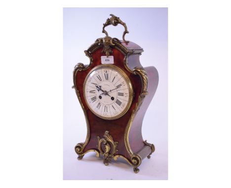 A Louis XVI style mantel clock, the 13.5 cm diameter enamelled dial signed CIE DES Bronzes/La HAYE with Roman numerals, fitte