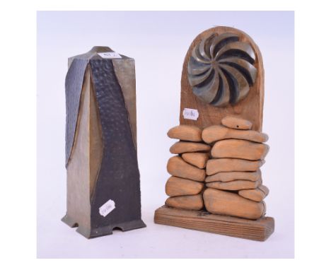 A cast metal sculpture lamp base, 32 cm high, a wood and metal sculpture, and another (3)