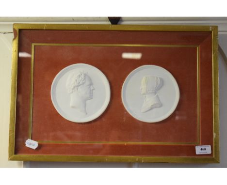A pair of plaster bust portrait roundels, 14.5 cm wide, framed as one