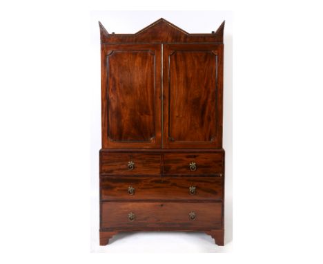 A 19th century mahogany linen press, having an unusual architectural cornice, the top section adapted for hanging, above two 