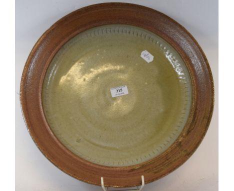 A Richard Batterham earthenware bowl, with a light green glaze, 40 cm diameter