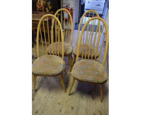 A set of four Ercol beech and elm hoop back kitchen chairs (4)