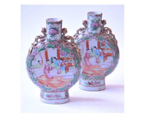 A pair of Cantonese famille rose moon flask vases, decorated figures, some restoration, 25 cm high and a Chinese dish, of lob