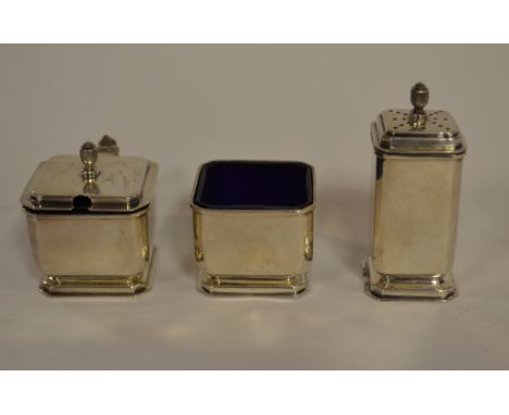 A silver three piece condiment set, Birmingham 1938, a brass tray, decorated a tiger, a snuff box, a photograph frame, and ot