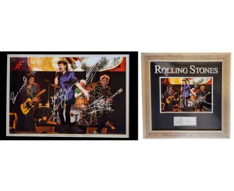 Rolling Stones multi signed by Keith Richards, Mick Jagger, Ronnie Wood and Charlie Watts framed photo. Measures 20 inch by 1