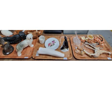 Three trays of oddments to include: ceramic study of a Penguin, collection of Giraffes to include: Giraffe ceramic money box,