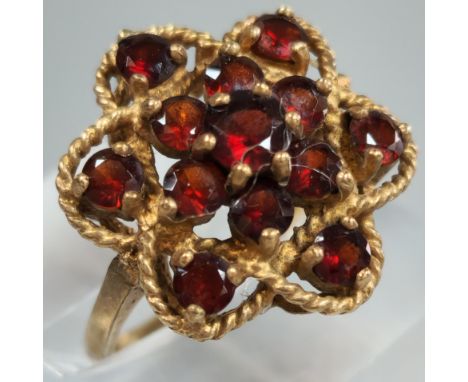 9ct gold garnet multi cluster flowerhead ring. 4.1g approx. Size K. (B.P. 21% + VAT)