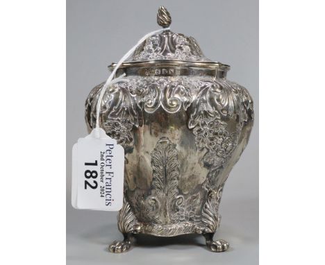 Late Victorian silver repoussé tea caddy on four paw feet. Chester 1896. Maker's mark initial R H. 8.6 troy oz approx. (B.P. 