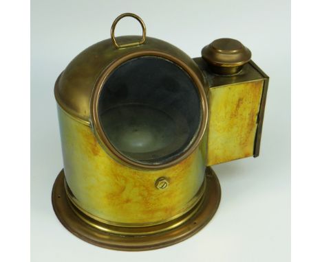 A VINTAGE BRASS ENCASED COMPASS ON GIMBAL