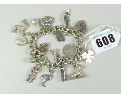 SILVER FLAT CURB LINK CHARM BRACELET with assorted charms to include lion, wild boar, Golden Gate bridge etc