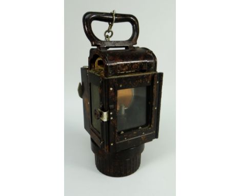 A THIRD REICH BAKELITE CARBIDE LANTERN BY PAG Numbered 1608/3, bears rubbed swastika to hook, 28cms high