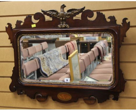 A GOOD ANTIQUE WALL MIRROR having gilded moulded eagle finial and gilded moulded slip with a shaped and carved border and She