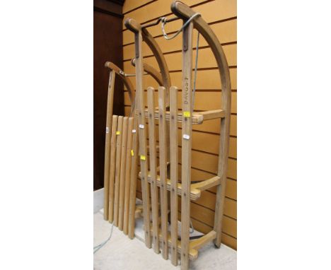 TWO VINTAGE WOODEN SLATTED SLEDGES
