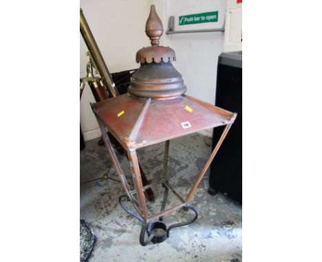AN ANTIQUE METALWORK STREET LANTERN ENCASEMENT with circular finial