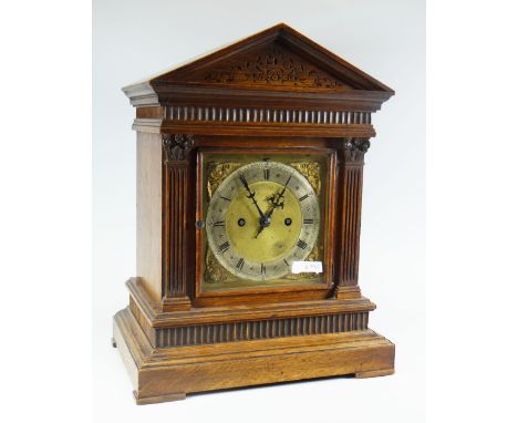 A FUSEE OAK ENCASED GERMAN-TYPE ARCHITECUTURAL MANTEL CLOCK, 41cms high