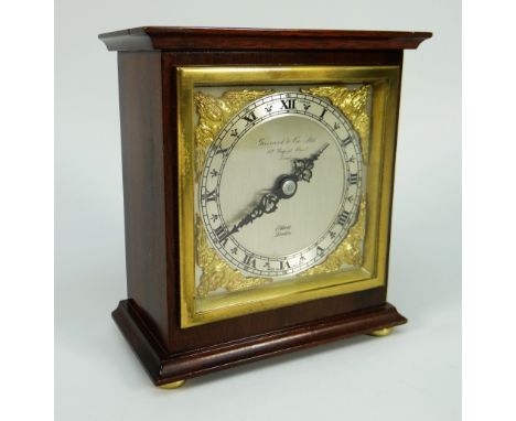 A NEAT ELLIOT OF LONDON MANTEL CLOCK inscribed 'Garrard &amp; Co. Ltd London' to the silvered dial 14cms high