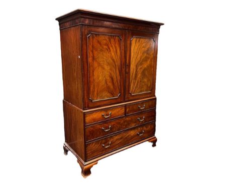 A George III mahogany linen press, on ogee bracket feet,194 x 134 x 70cm