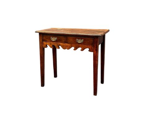 A George III style oak side table, with two frieze drawers over a shaped apron on square section legs,75 x 85 x 43cm