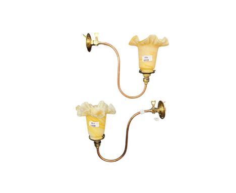 A pair of South Metropolitan Gas Co. copper and brass wall lights, converted to electricity with glass shadesThe brass fittin
