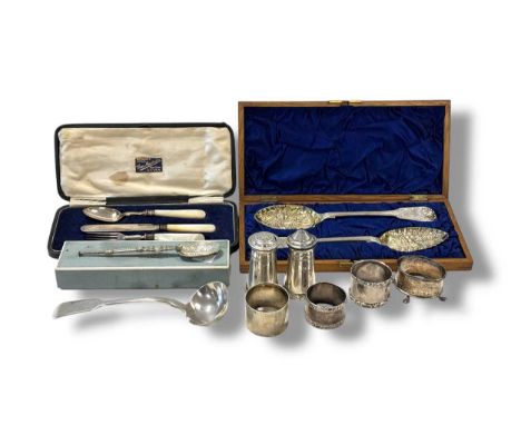 A collection of silver including flatware, cruets, napkin rings etc., 493g (16ozt) gross, together with a cased three-piece c