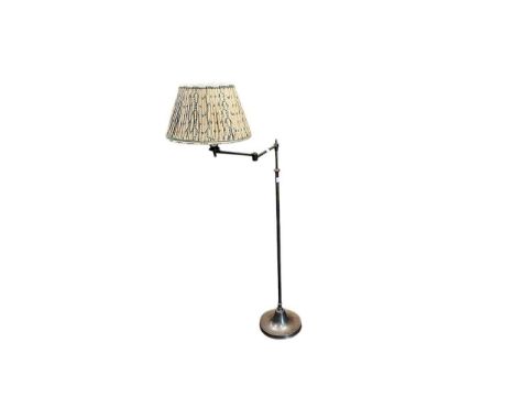 A late 20th century brushed brass standard lamp, possibly Besselink &amp; Jones, with swing arm on a tapered circular base, w
