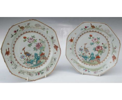 A pair of octagonal porcelain plates, likely 18th century Qianlong period, the centre painted with crane and peonies, the bor