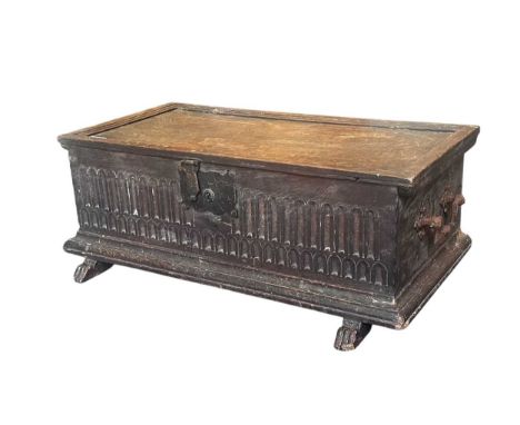 A 17th century oak bible box, nulled carved front panel over trestle feet,26 x 70 x 36cmthe top has multiple splits, signs of