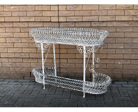 A 20th century French white painted wirework two tier planter, the two oblong shaped planters with scroll work decoration,80 