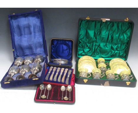 A Crown Staffordshire coffee set with pierced silver mounts, cased, together with six silver tea spoons, a cased set of six s