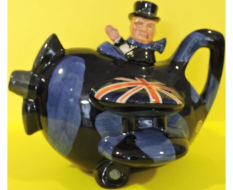 A Carlton ware limited edition porcelain Sir Winston Churchill teapot, modelled as The Statesman seated in a byplane, H: 16cm