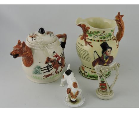 A Crown Devon John Peel musical jug, H. 19cm; together with a Royal Doulton model of a fox hound pup drinking from a saucer, 