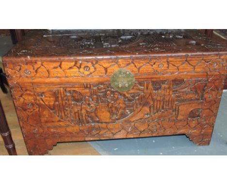 A 20th century carved camphor wood rectangular trunk, W.87cm.