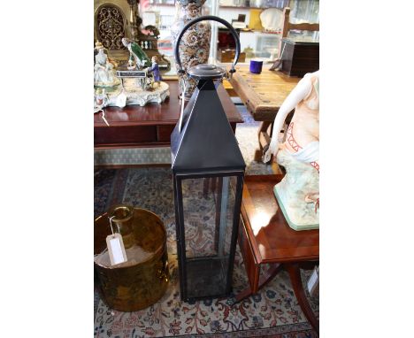 A tall square glazed, bronzed metal garden lantern, H.110cm