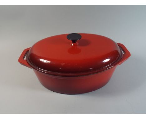 A Large Red Enamel Two Handled Cooking Pot with Lid, 47 cm Long