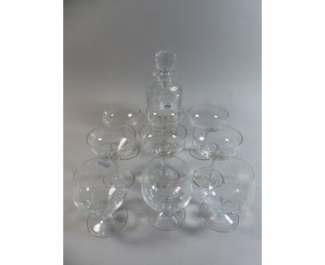 A Collection of Six Cut Glass Champagnes, Three Brandy Balloons and A Decanter 