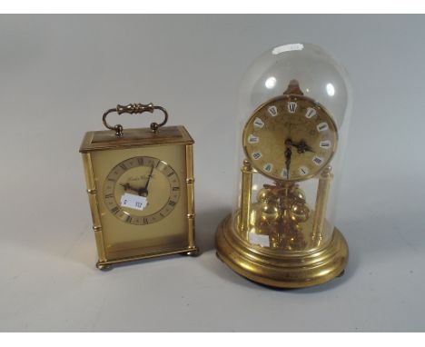 A London Clock Company Carriage Clock with Battery Movement and A West German Pillar Clock Under Plastic Dome