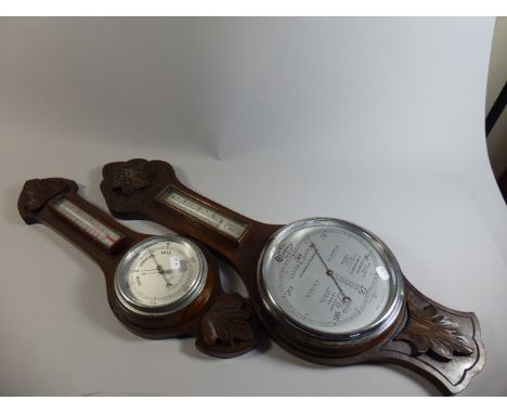 Two Late Victorian Oak Framed Wheel Barometers with Temperature Scales