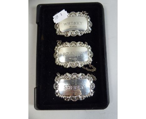 A Collection of Three Silver Decanter Labels for Whisky, Brandy and Sherry 