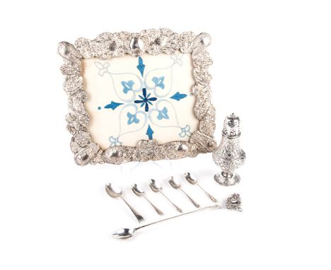  the shaped rectangular frame chased with C-scrolls and foliage, various makers marks, 32cm high, 25cm wide, dents ; A Silver